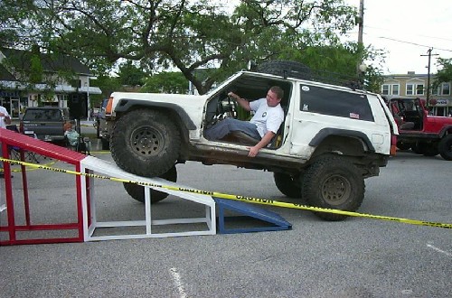 Man driving Jeep up ramp, Long Island Off Road