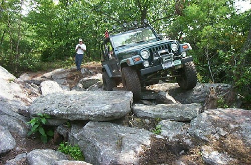 Jeep navigating rocky terrain