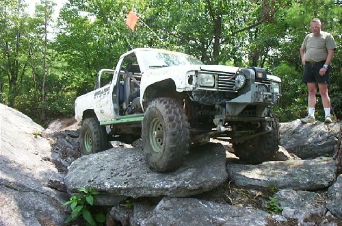 White truck navigating rocks