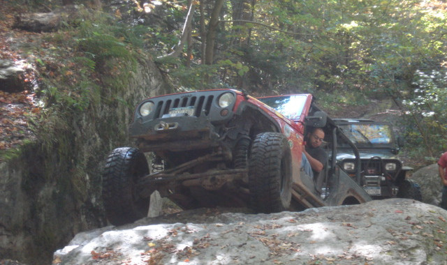 Jeep navigating rocky terrain