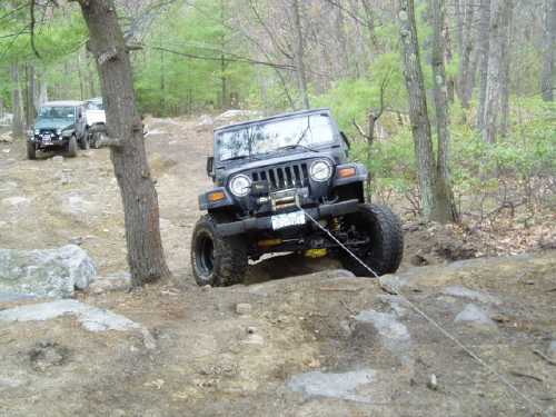 Jeep Wrangler off-roading on rocky trail