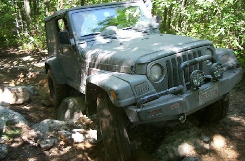 Jeep traversing rocky terrain