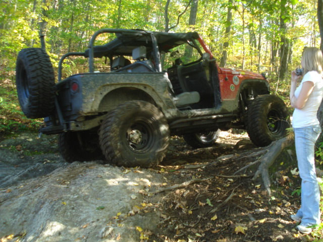 Red Jeep traversing Long Island Off Road trail