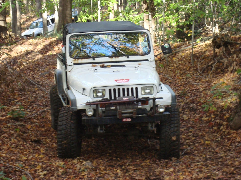White Jeep Wrangler on trail