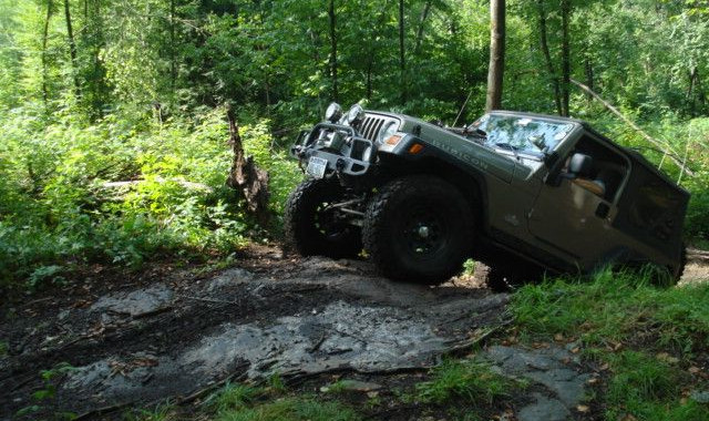 Jeep traversing rocky trail