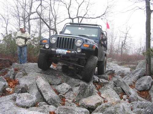 Jeep traversing rocky terrain