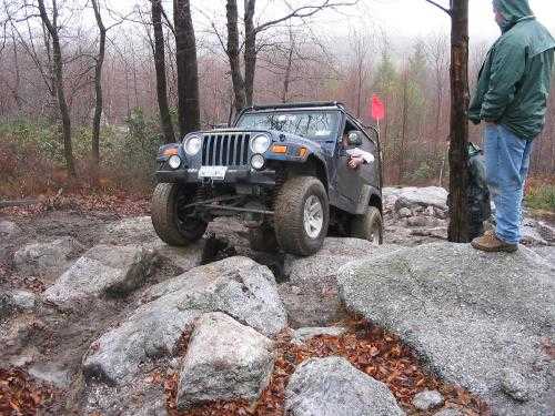 Jeep navigating rocky terrain