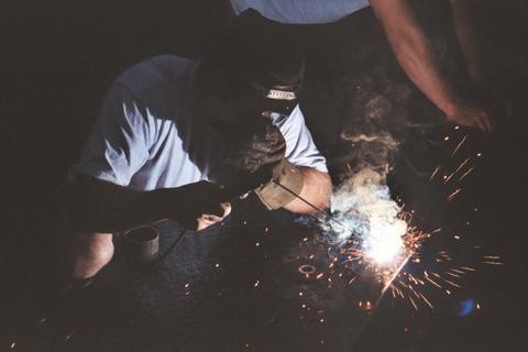 Welder at work, sparks flying