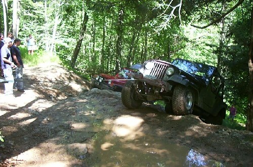Jeep and car on rocky trail