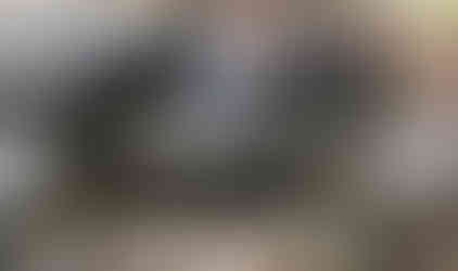 Man driving Jeep over rocks