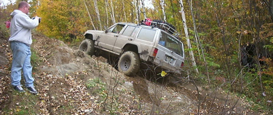 Jeep tackling rocky off-road trail
