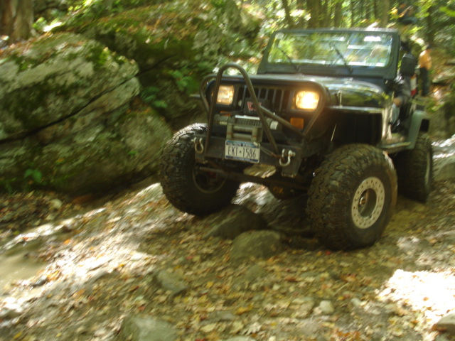 Jeep navigating rocky trail