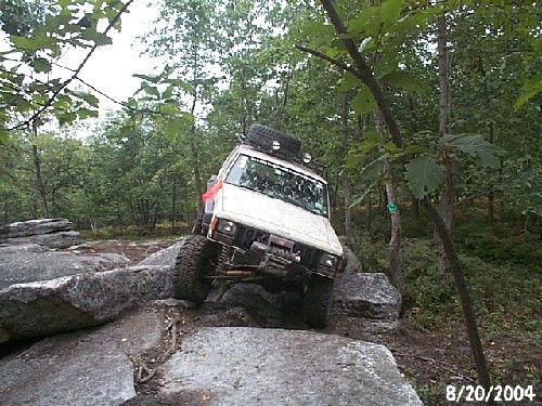 Off-road vehicle navigating rocks; Bark and I are "On The Rocks" '04