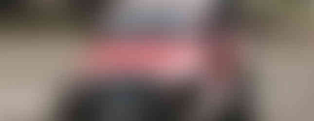 Red Jeep Wrangler off-roading