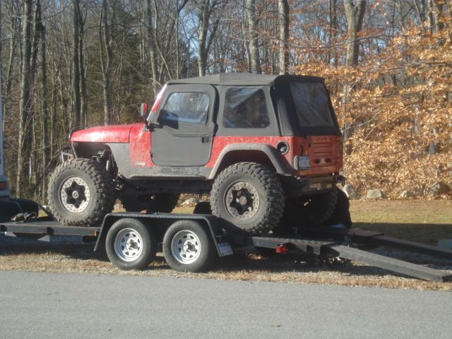 Red Jeep Wrangler on trailer