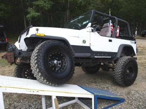 White Jeep Wrangler on ramp