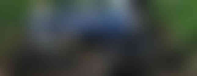 Blue Jeep Wrangler off-roading