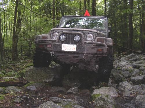 Jeep traversing rocky terrain
