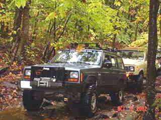 Jeep Cherokee off-roading on trail