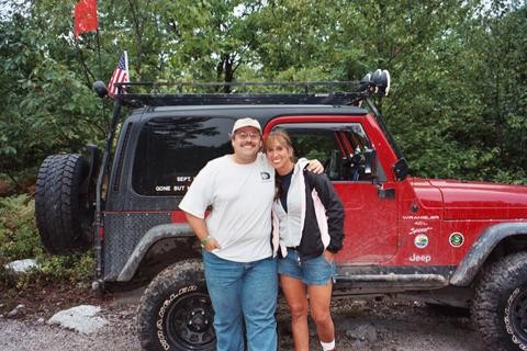 Couple beside Jeep at Carnage Hill