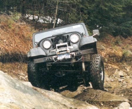 Jeep traversing rocky terrain