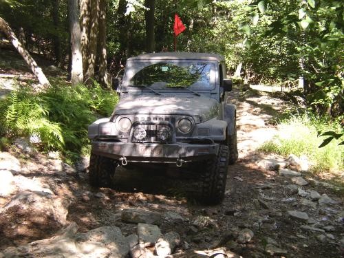 Jeep traversing rocky trail