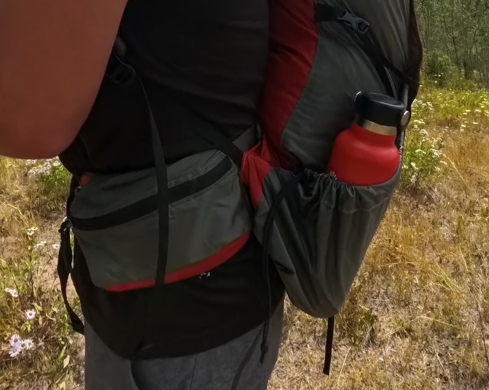 Showcasing the zipper pockets on the Virga3 55 Liter backpacking backpack.