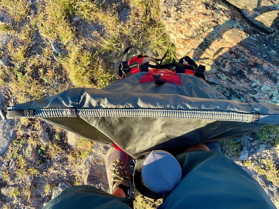 Showcasing the roll-top feature on the Virga3 55L backpack.