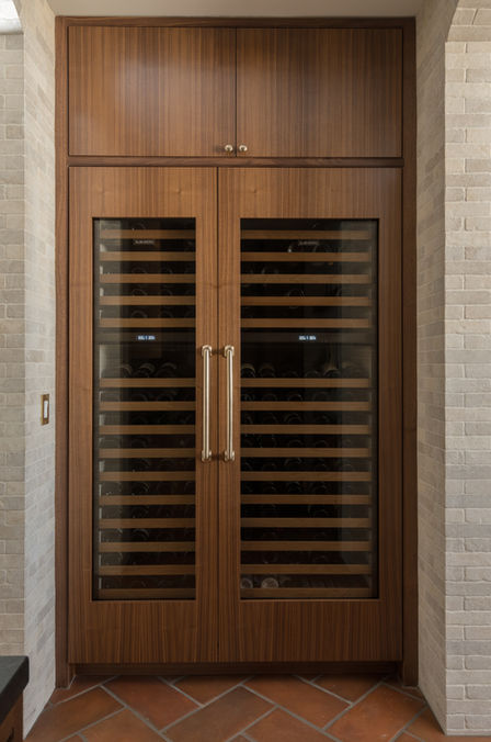 Luxury residential interior design in North County San Diego by Rose Lake Design featuring a custom kitchen with tailored neutral cabinetry and integrated appliances, an adjacent wet bar with custom millwork and stone countertops, a built-in breakfast nook with upholstered banquette seating, and a fully customized walk-in pantry with floor-to-ceiling storage, all designed with refined materials, layered lighting, and cohesive architectural detailing.
If you’d like to further strengthen hyper-local SEO, I can also create versions that strategically reference areas such as Del Mar, Rancho Santa Fe, Encinitas, or Carlsbad depending on where this project is located.