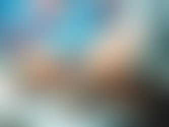 Hands typing on a keyboard with colorful digital icons like cloud and heart floating above, suggesting internet communication.