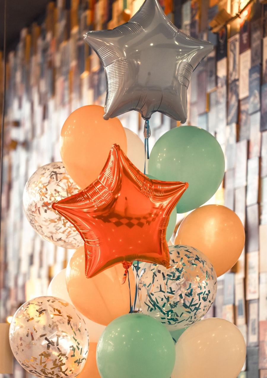 A bunch of balloons in a room