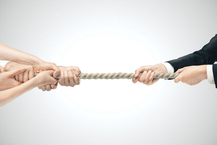 Hands holding a rope