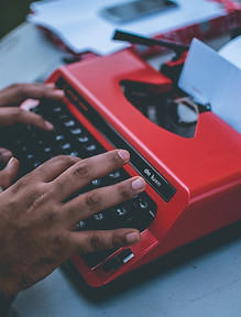 black-hands-red-typewriter