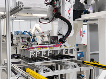 Bespoke machine system with robotic handling, fixtures and guarded automation tooling