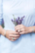 Close up of hands holding a bunch of lavender