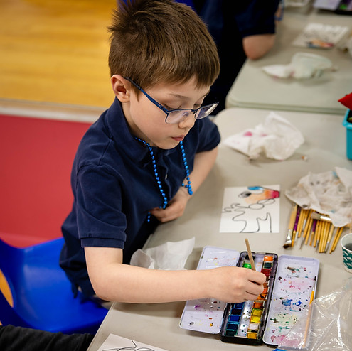 Child participating in a hands-on therapy activity at Circle Creek Therapy