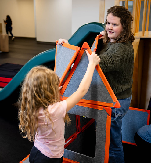 Child using a colorful building toys during a therapy session
