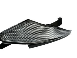 2K two-shot molded headlamp lens: clear PC honeycomb optics with black frame molded in one piece, by Howmin multi-shot mold