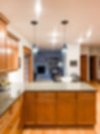 Kitchen with instant pendants over island