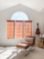 sitting room window with wood blinds