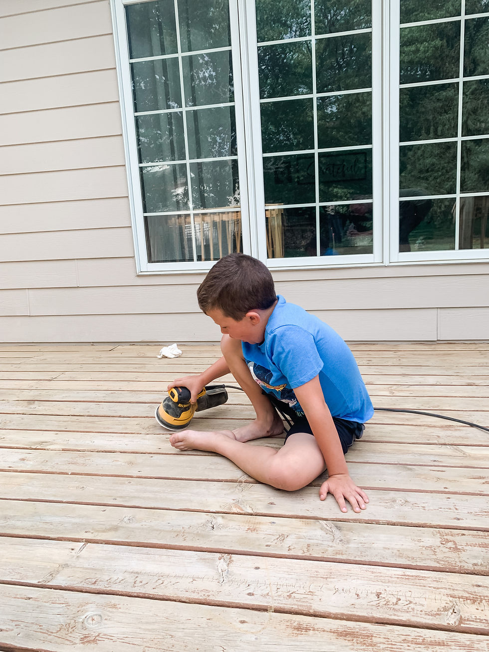 hank sanding the deck