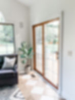 sunroom with white walls and white trim