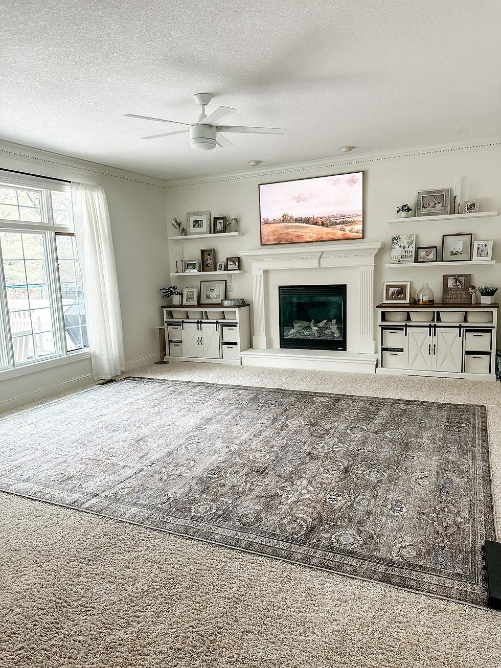 empty living room with new rug in center