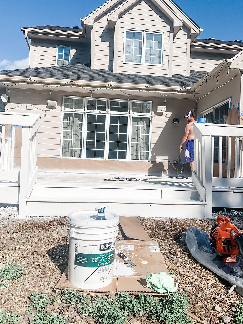 zach painting the deck white