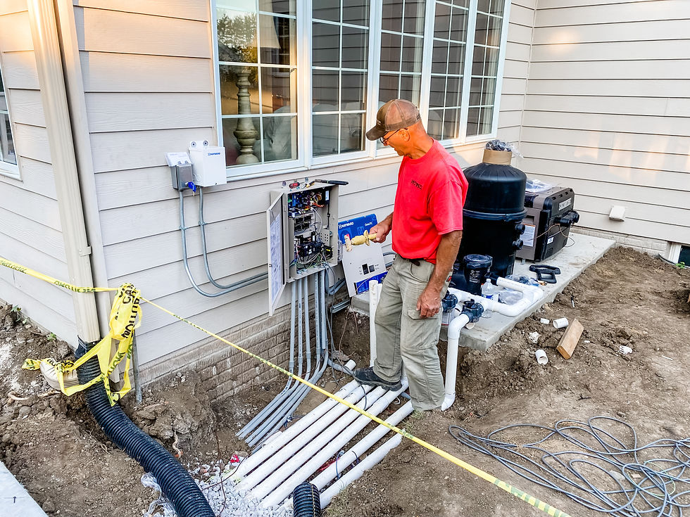 man at electrical panel for pool equipment