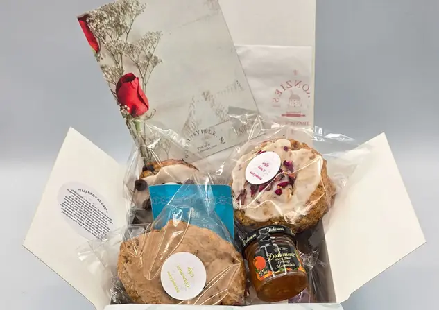 Ultimate scone gift basket with assorted scones and gourmet jam.