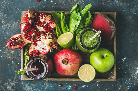 Green and purple fresh juices or smoothi