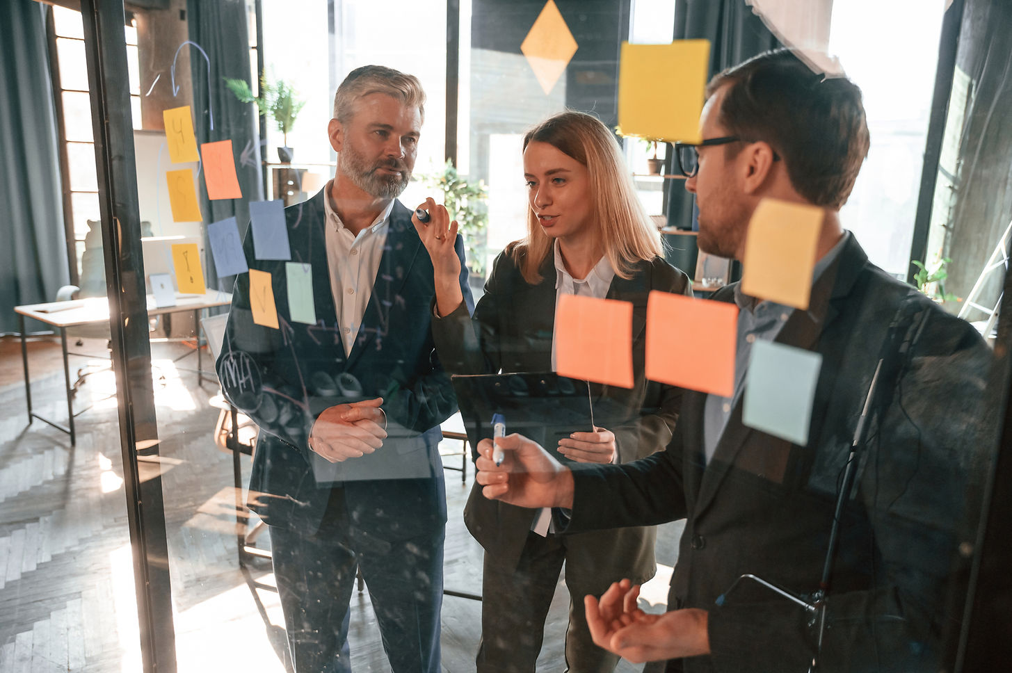 bunch-stickers-are-glass-group-business-people-are-working-modern-office.jpg