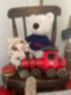 Red toy train and teddy bear vintage items for sale.
