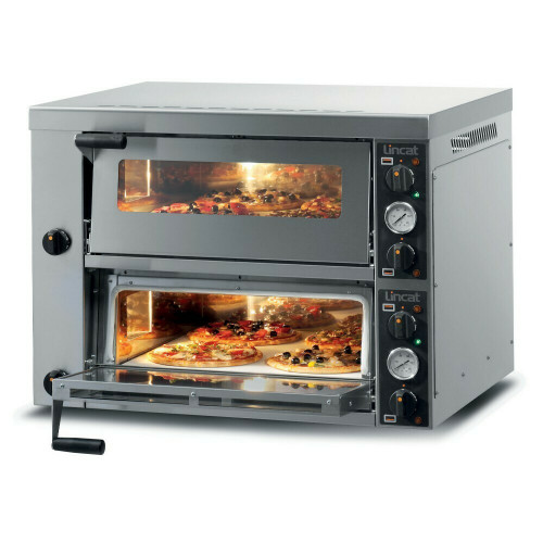 Double-deck pizza oven baking pizzas